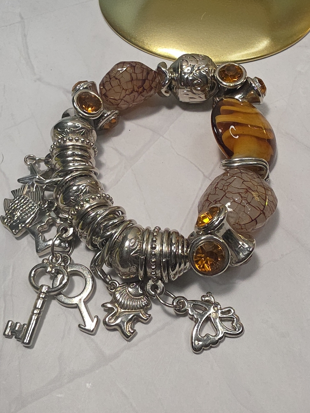 Silver Charm Bracelet with Amber and Beige Beads